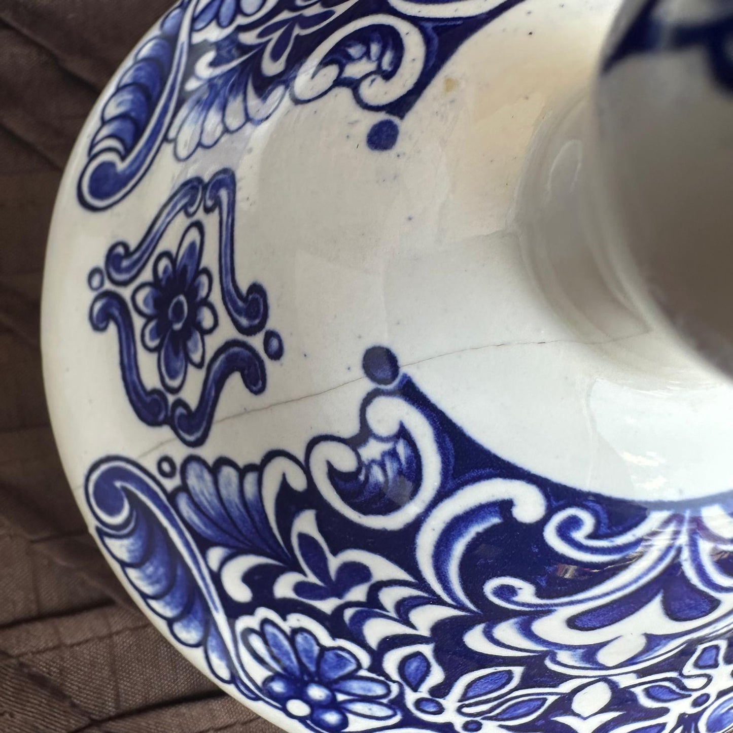 Close-up of a ceramic dish with blue and white intricate patterns.