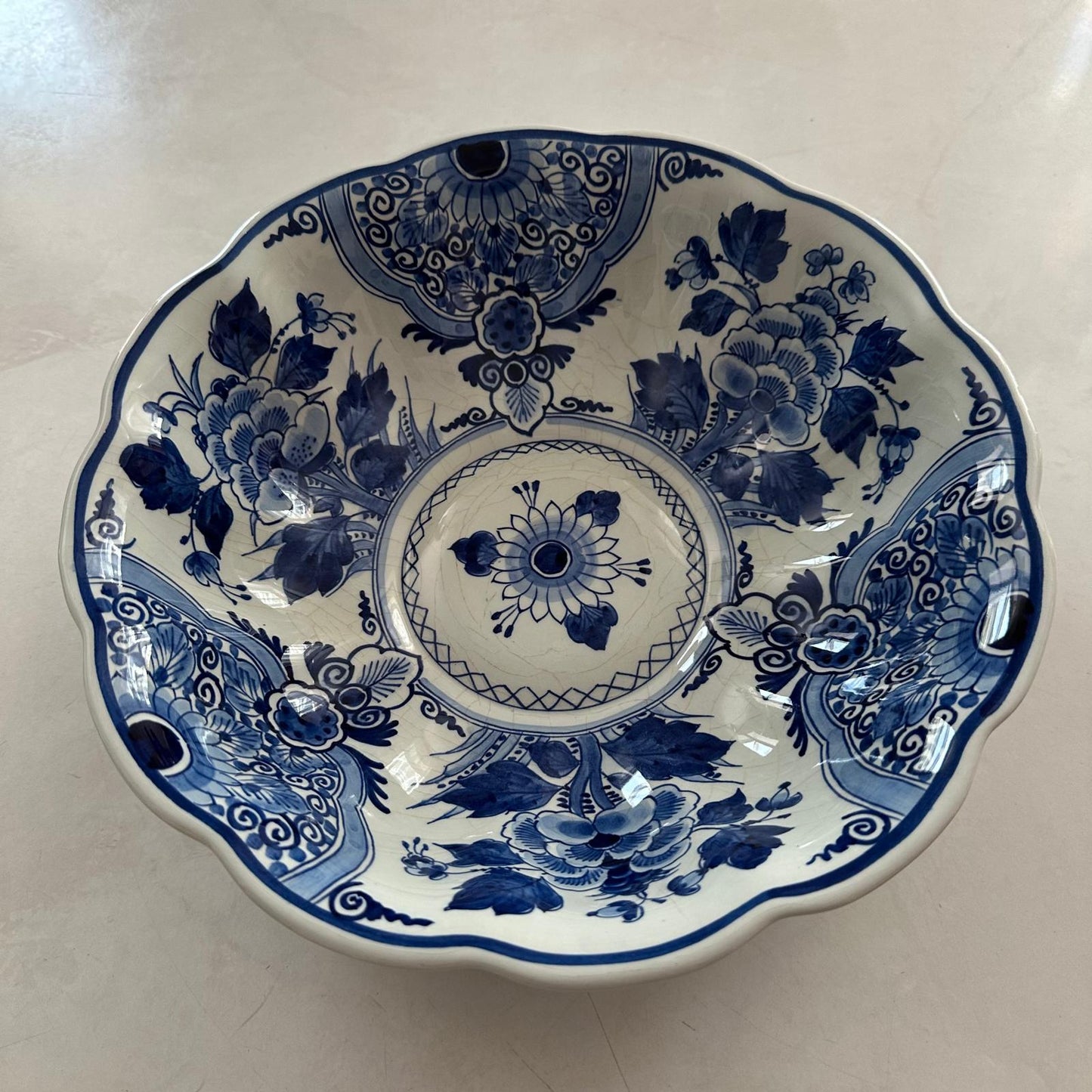 Blue and white floral ceramic dish on a light background