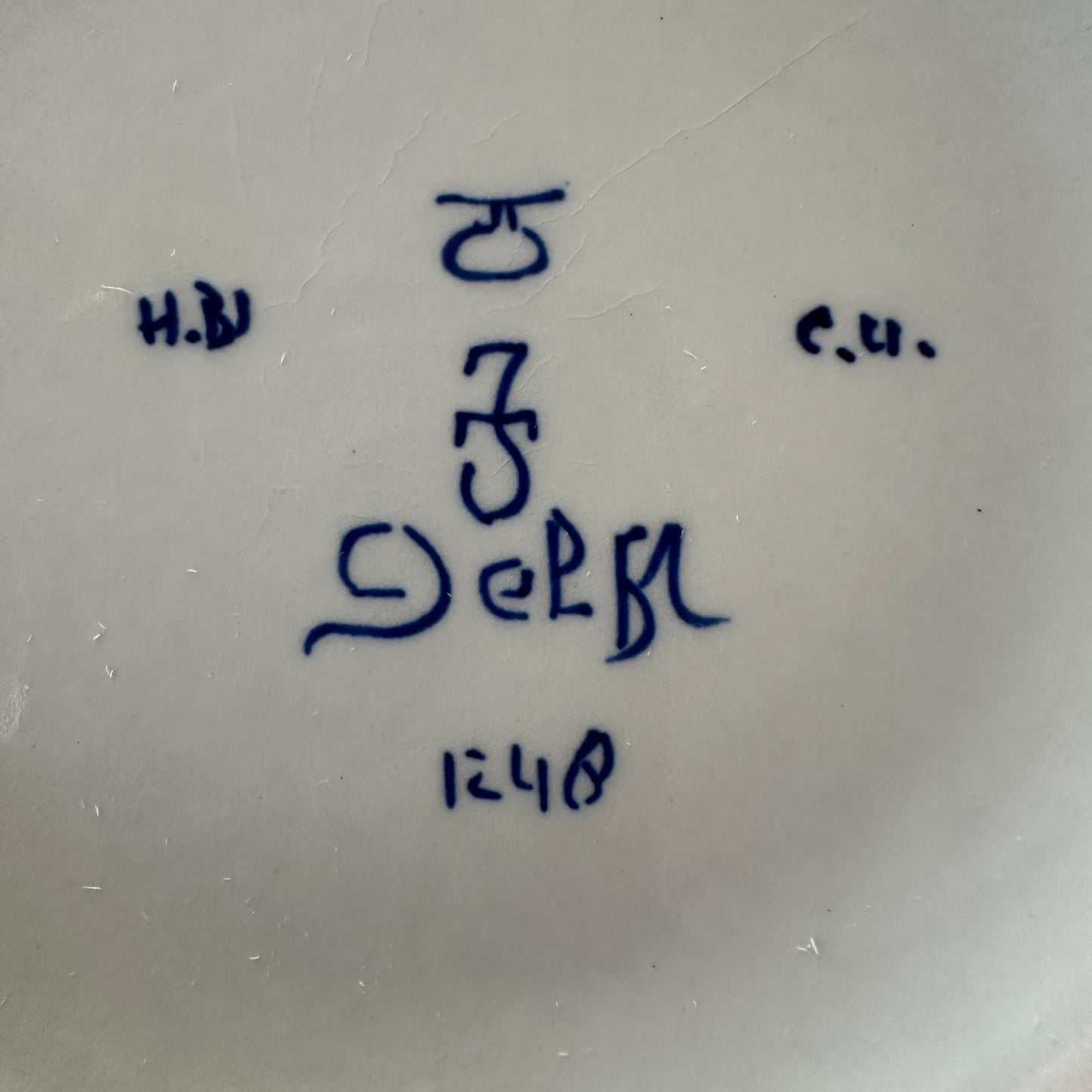Blue handwriting on a white surface
