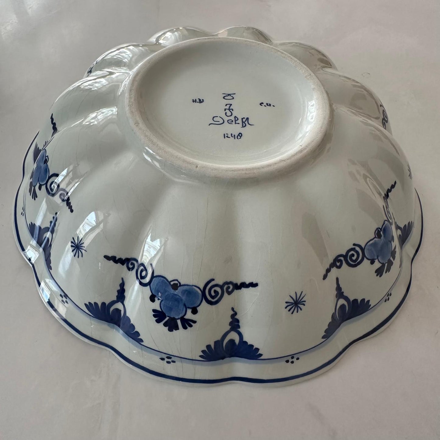 White ceramic dish with blue floral patterns on a white background