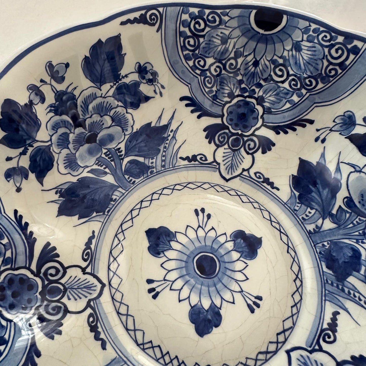 Blue and white ceramic plate with intricate floral patterns