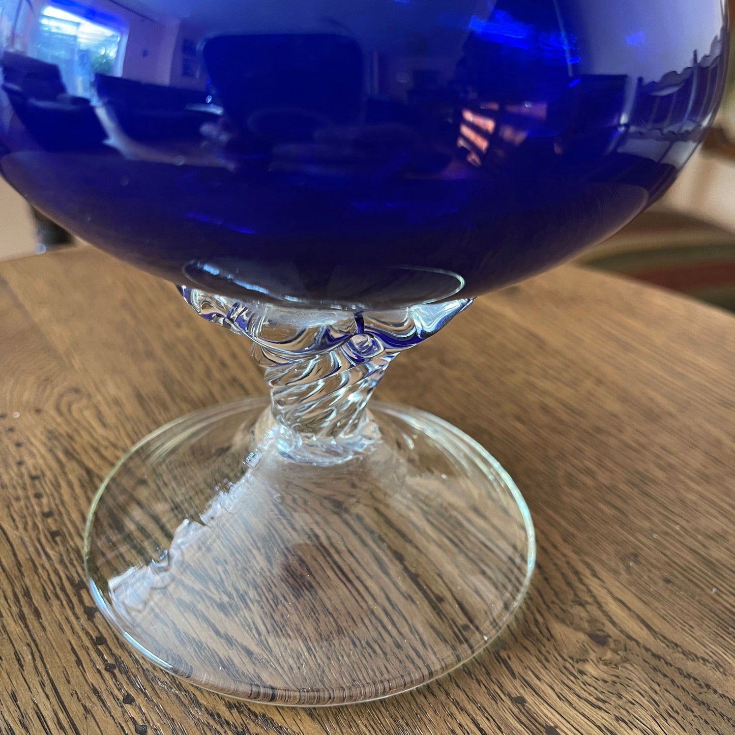 Blue glass goblet on a wooden table