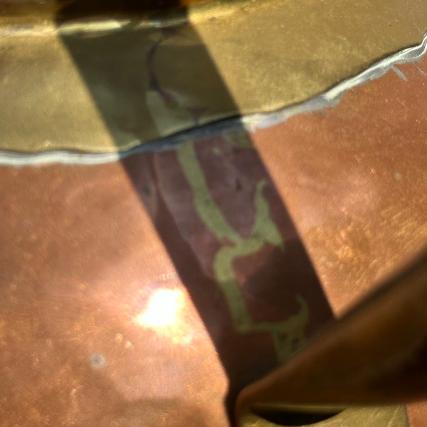 Close-up of a textured surface with gold and brown colors
