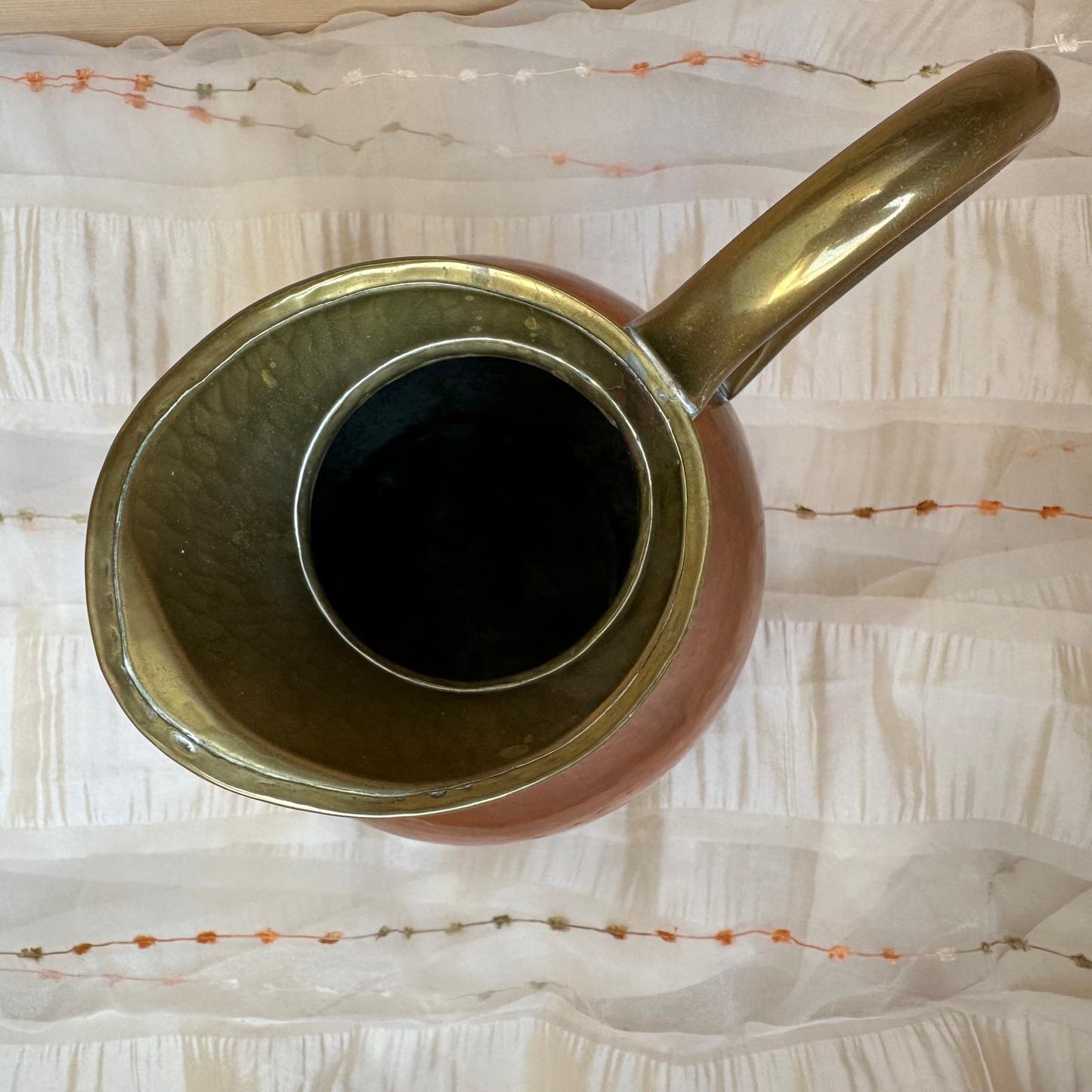 Vintage-style teapot on a textured white surface