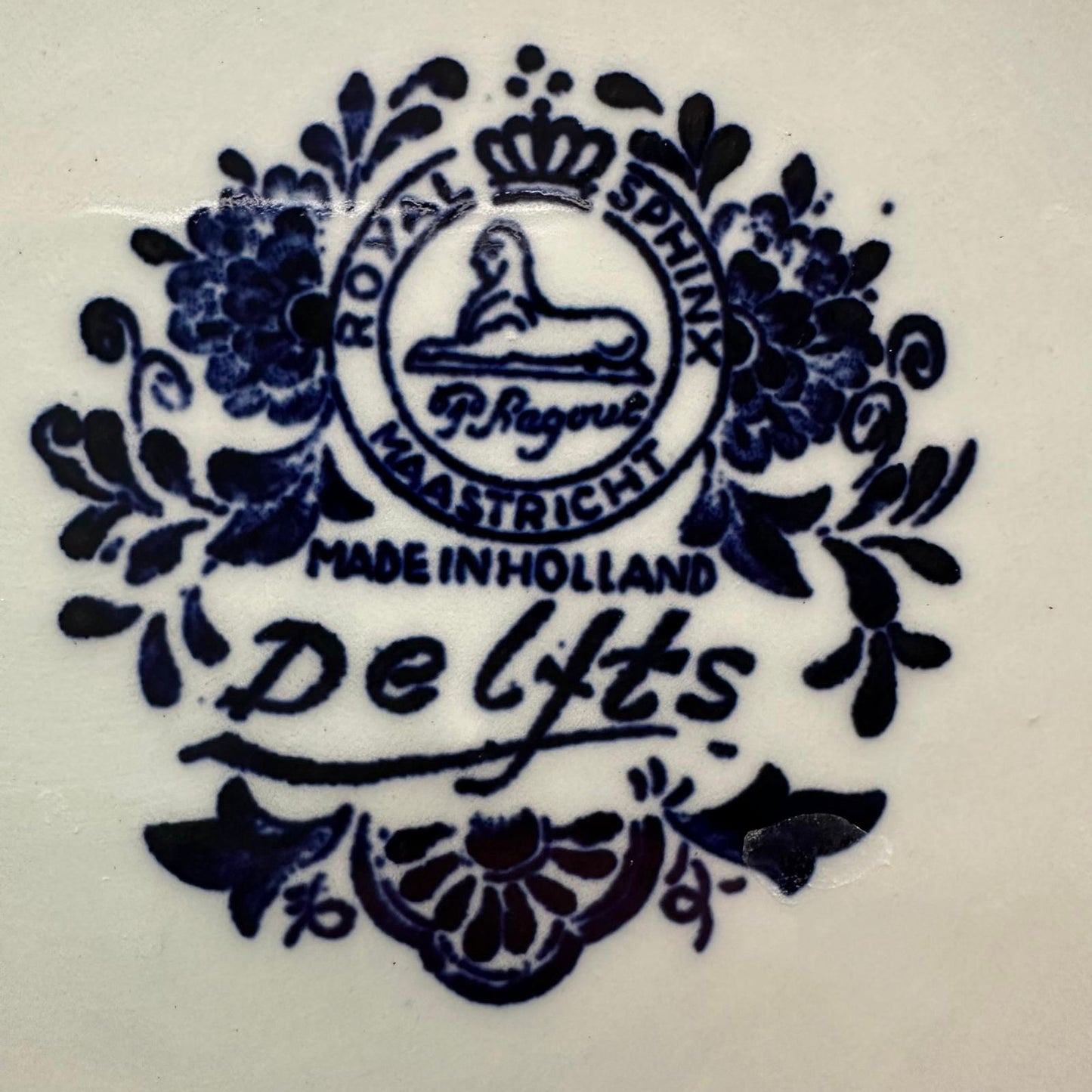 Decorative logo with 'Royal Sphinx Delfts' branding on a white background
