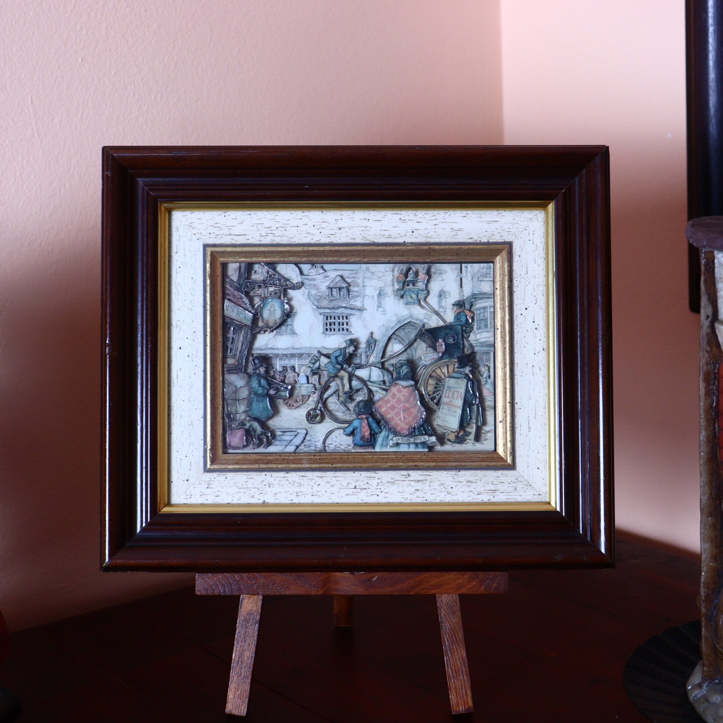 3D Paper Illustration by Anton Pieck of a street scene with a cyclist