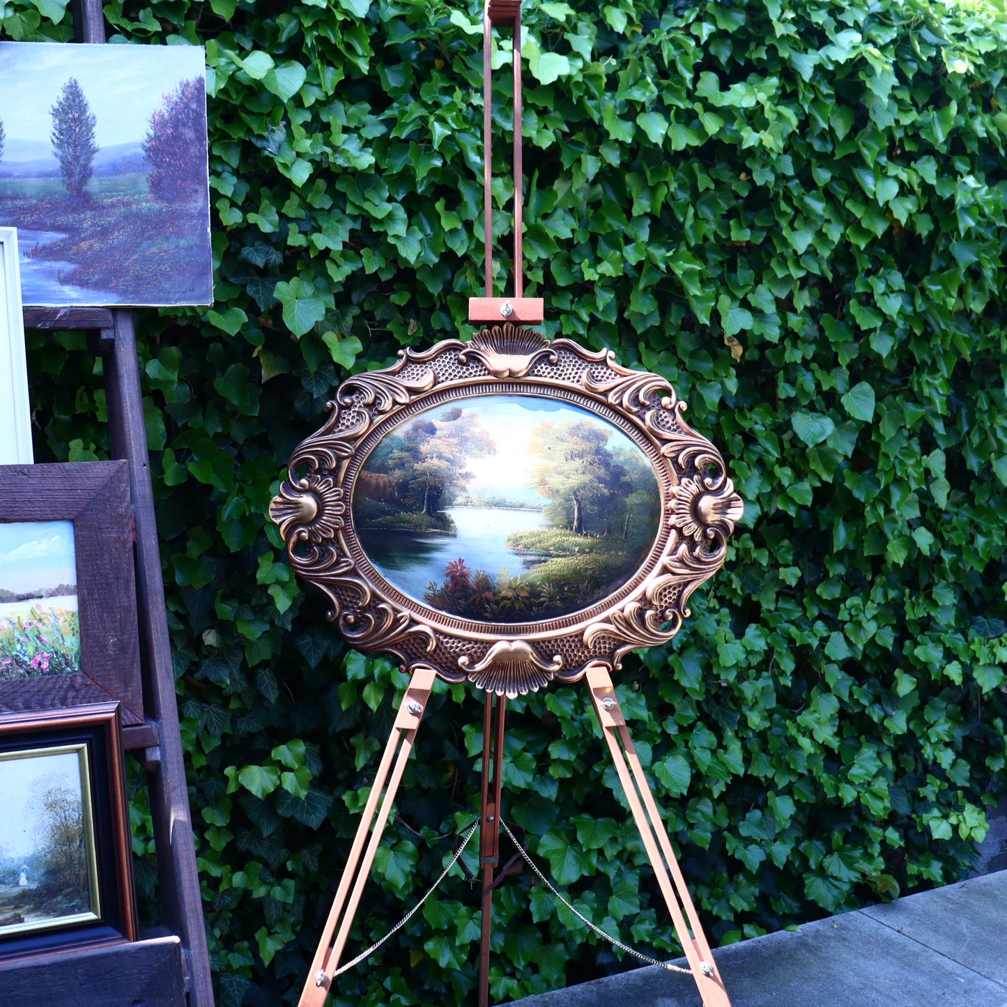 Landscape on wood in an oval frame