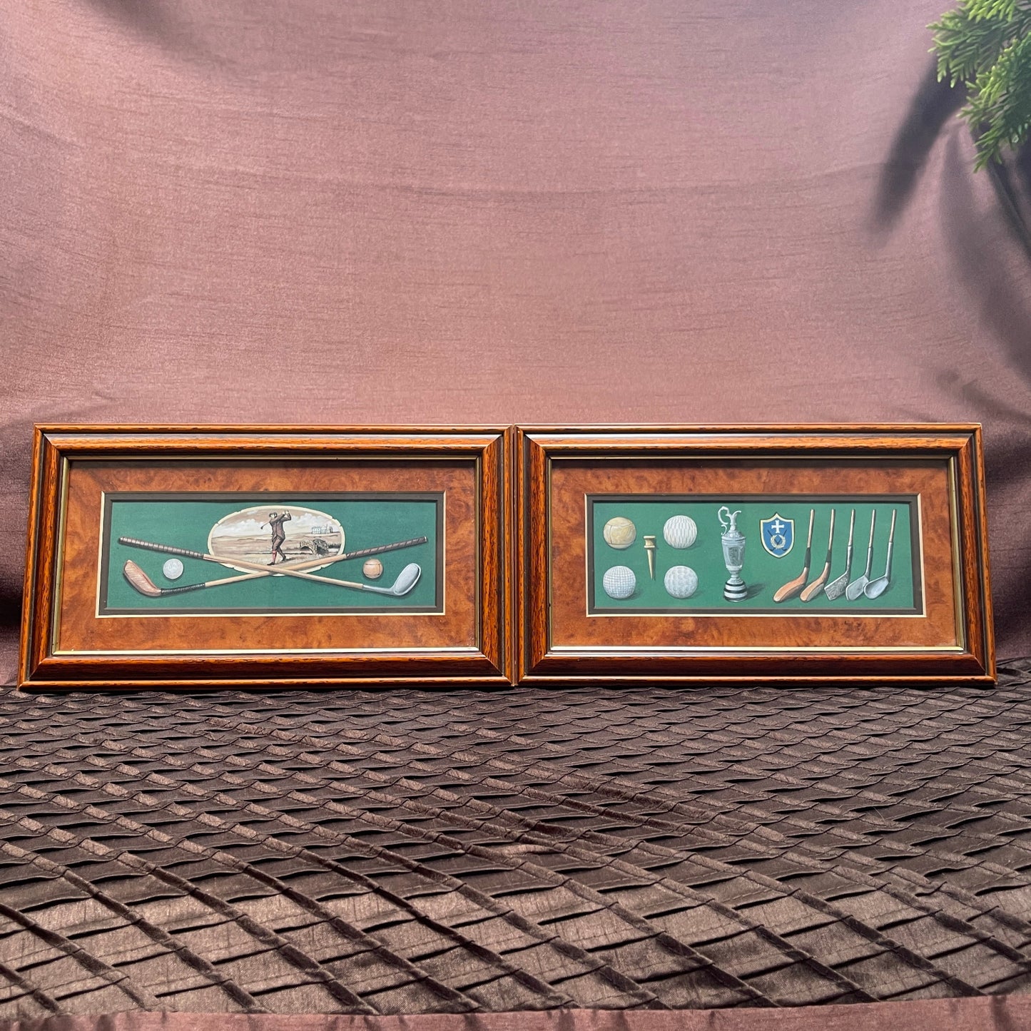 Two framed pictures on a textured surface with a neutral background