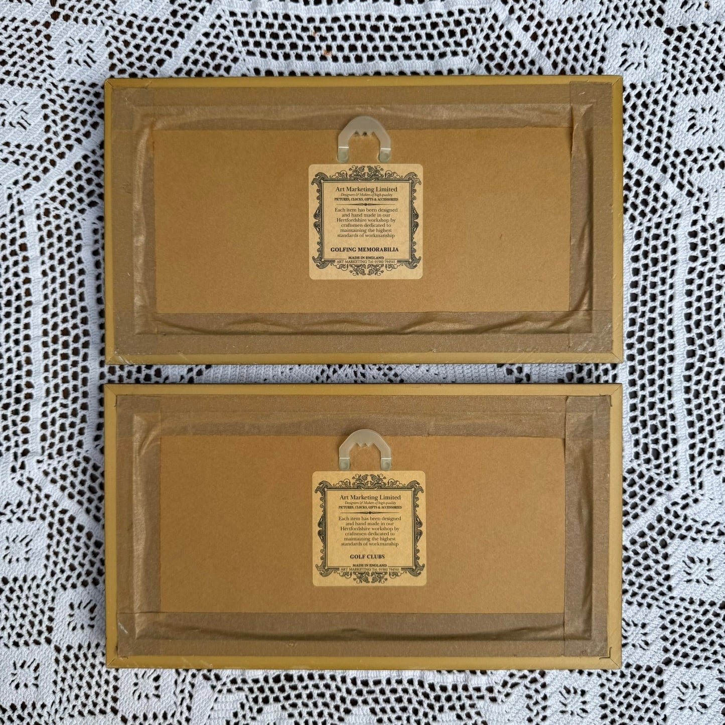 Two brown paper bags with printed labels on a patterned fabric background