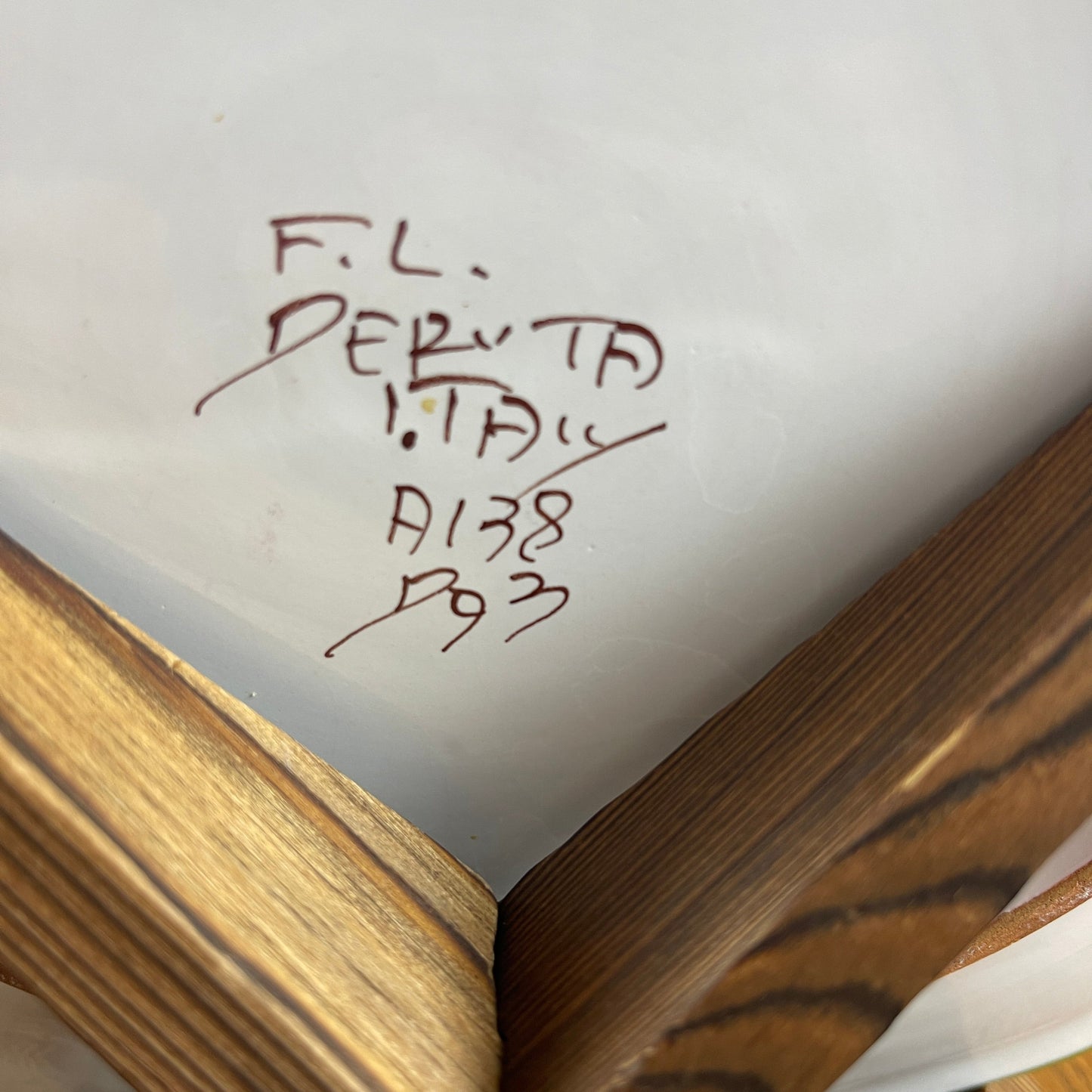 Close-up of a book with handwritten text on the cover
