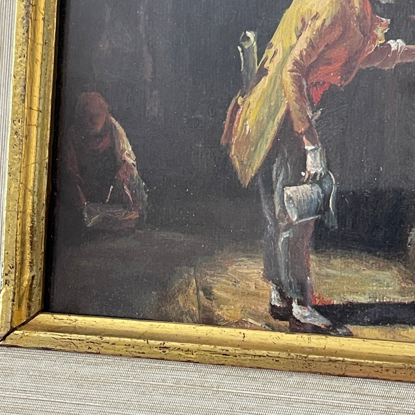 Painting of a person with a yellow garment and another figure in the background, framed in gold.