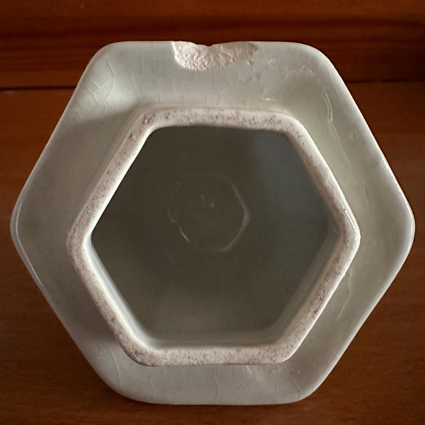 Hexagonal ceramic dish on a wooden surface