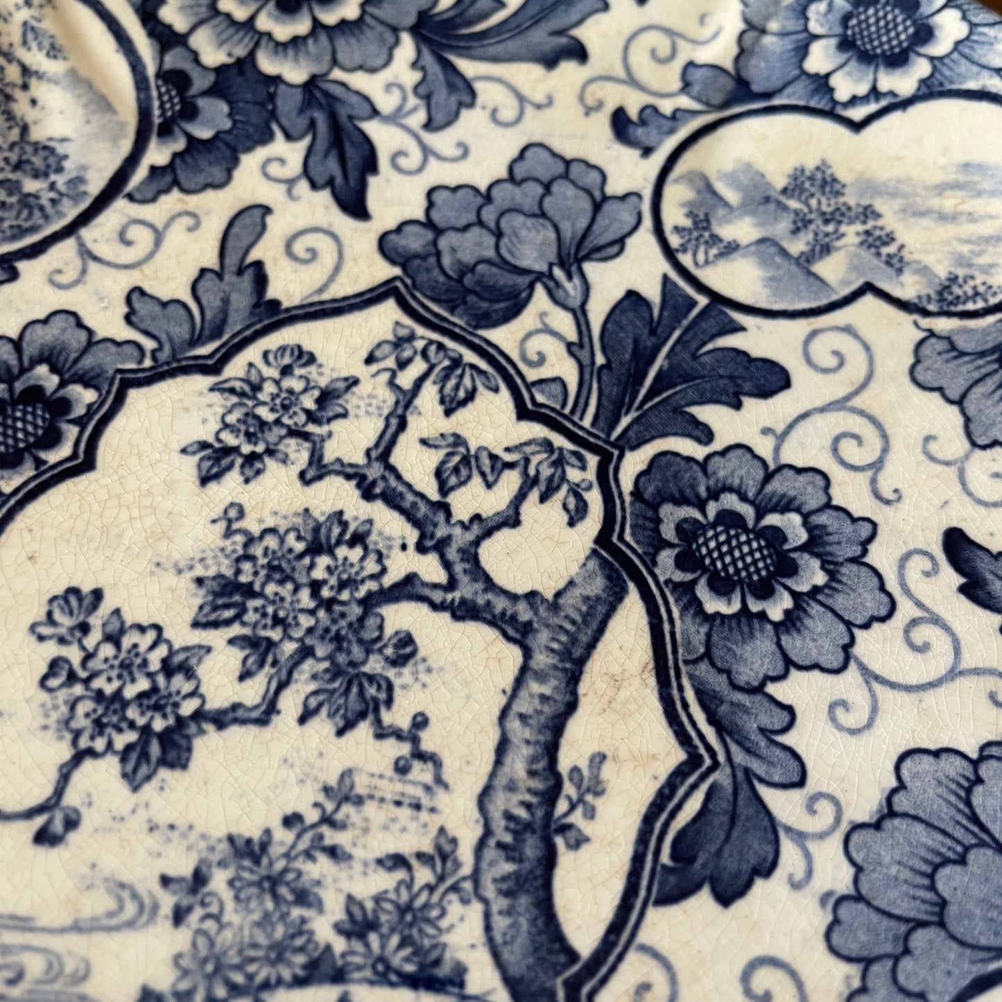 Blue floral and tree pattern on a beige background