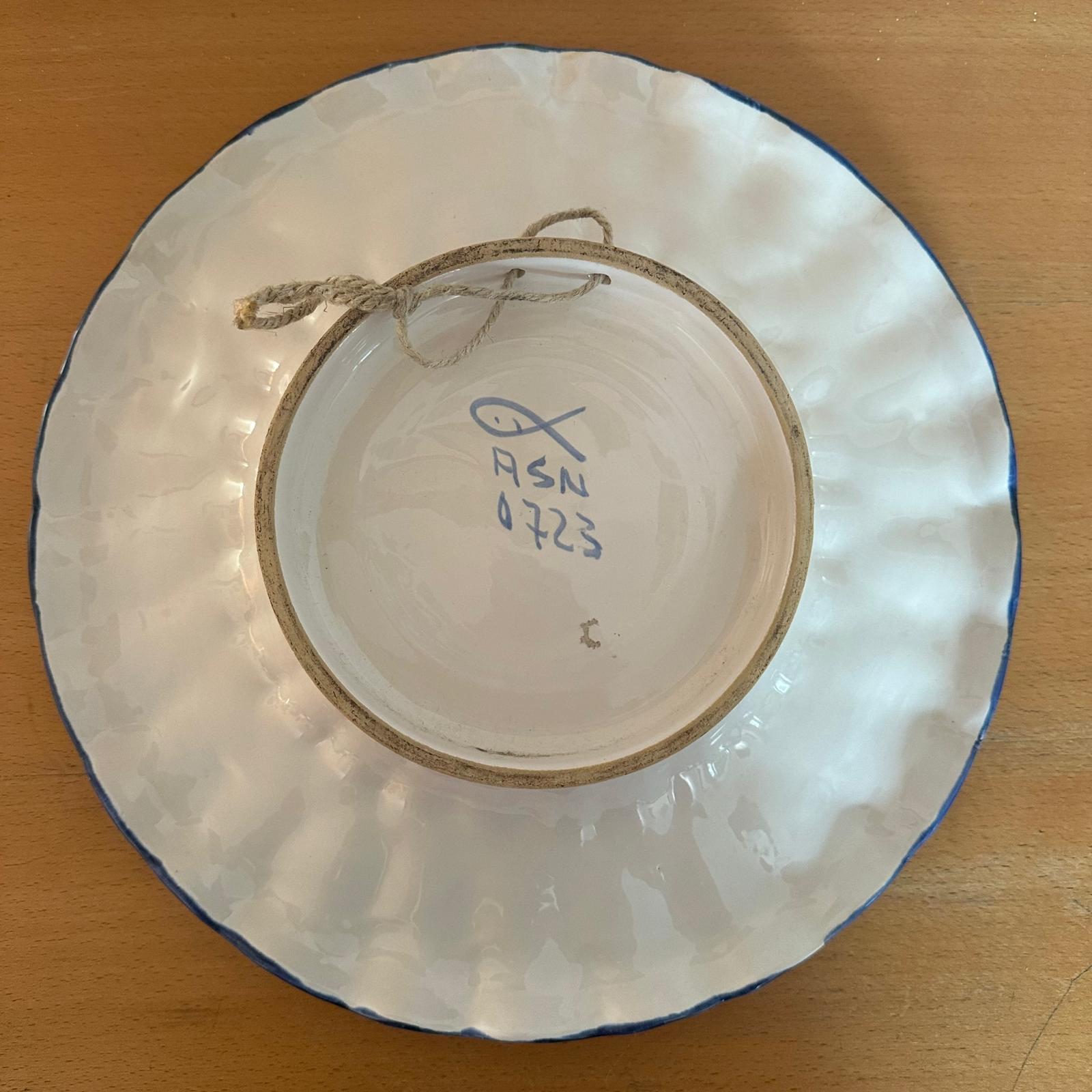The back of the ceramic plate with the manufacturer's mark