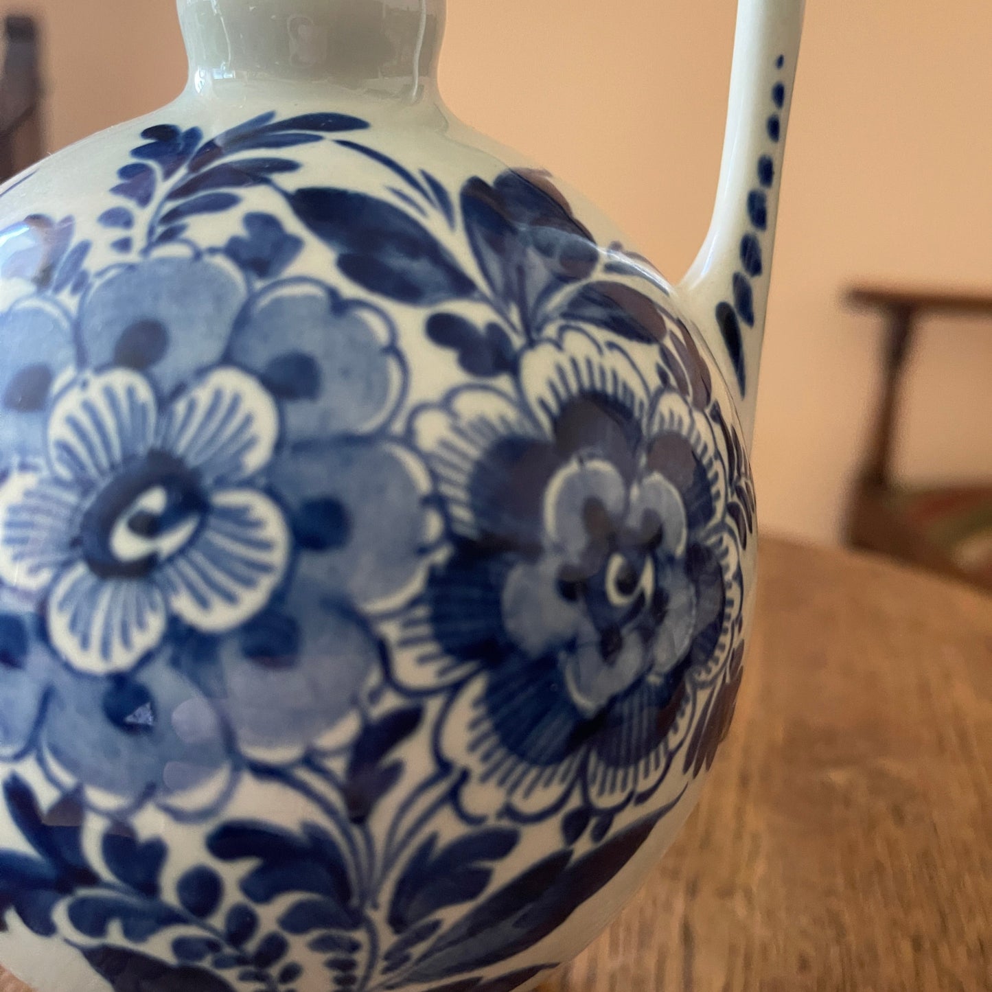 Blue floral pattern on a white ceramic vase