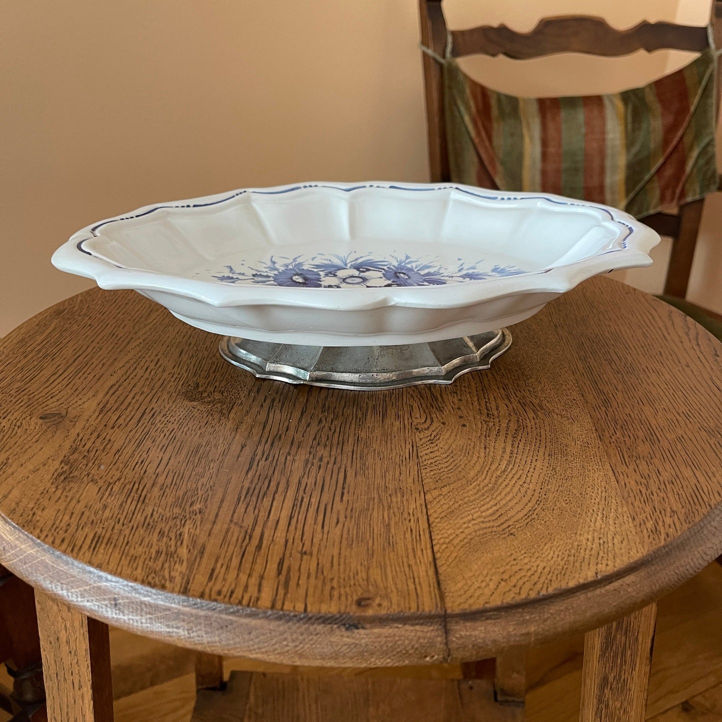 Decorative ceramic bowl with blue floral patterns on a wooden table