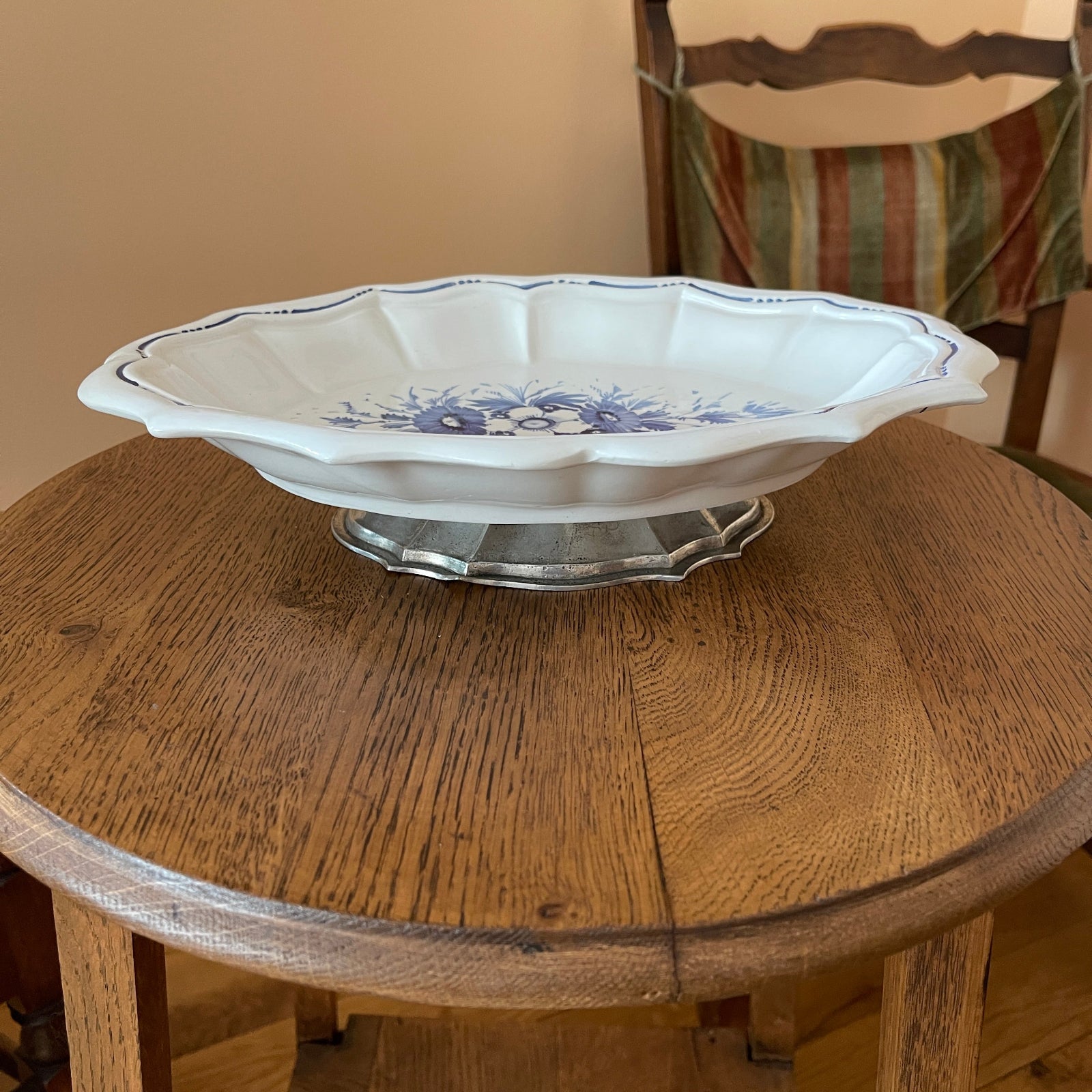 Decorative ceramic bowl with blue floral patterns on a wooden table