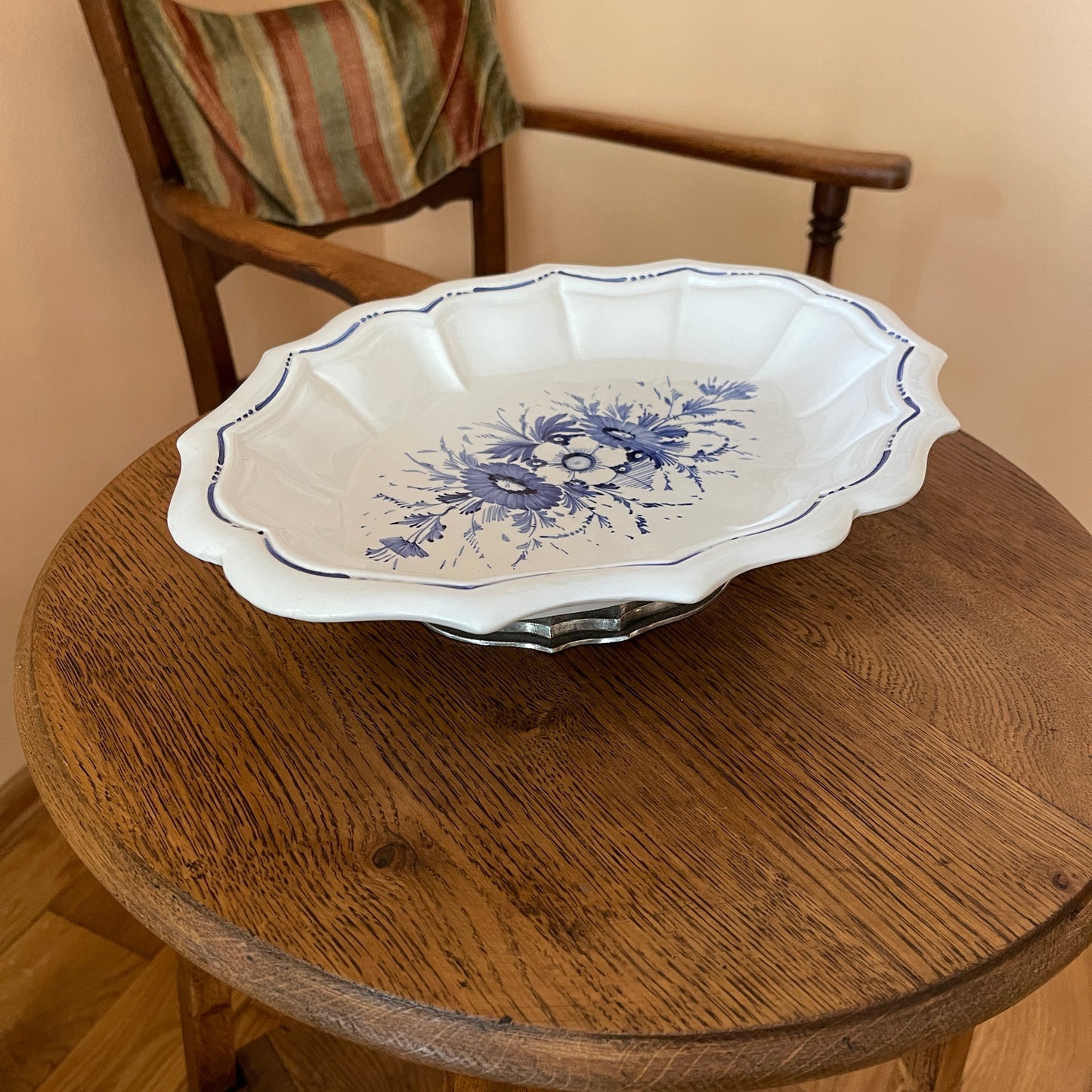 White ceramic dish with blue floral patterns on a wooden table