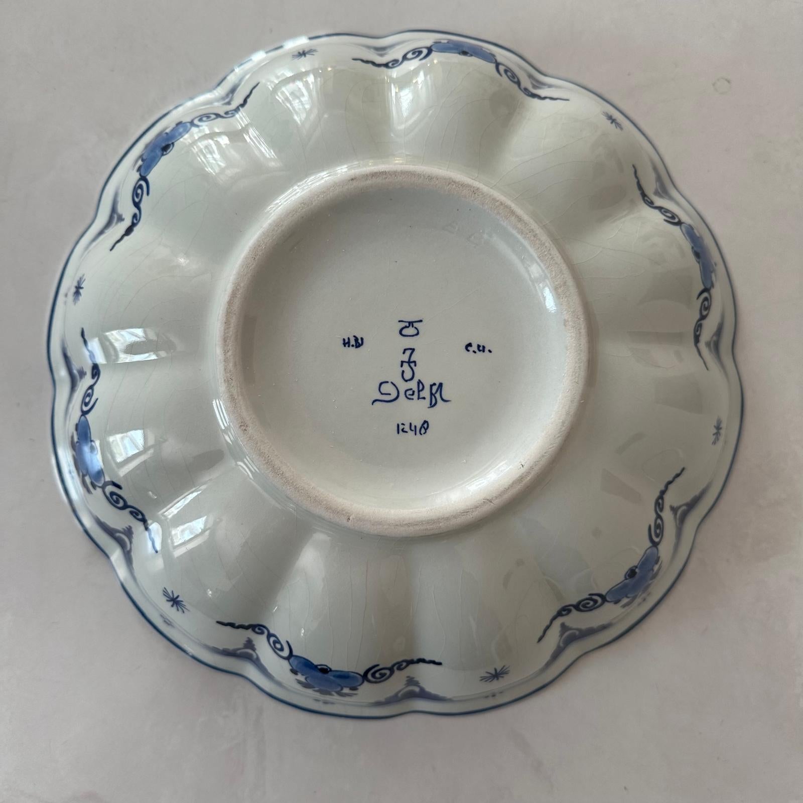 White ceramic dish with blue decorative patterns on a white background