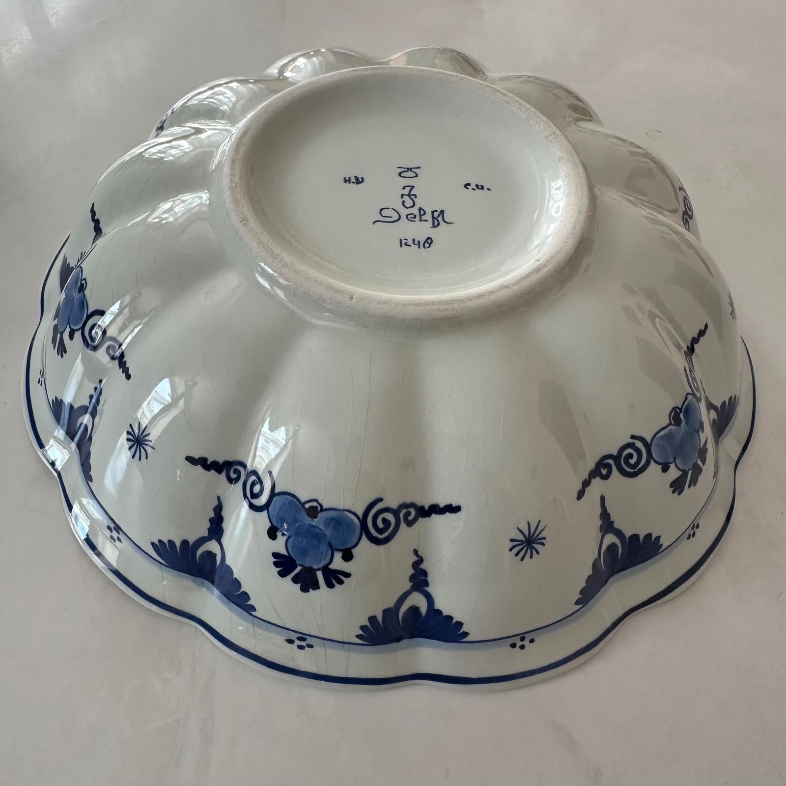 White ceramic dish with blue floral patterns on a white background