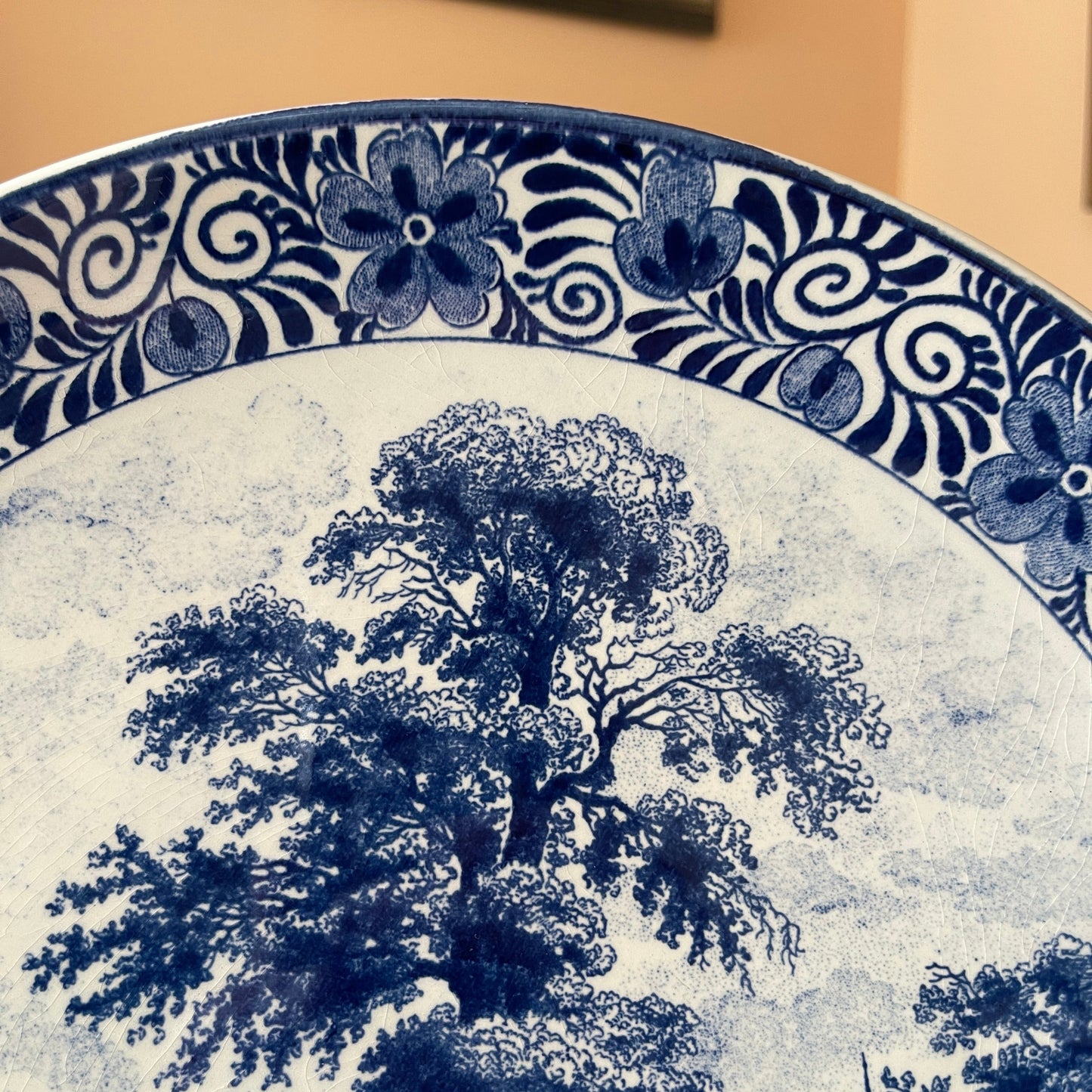 Blue floral and tree design on a ceramic plate