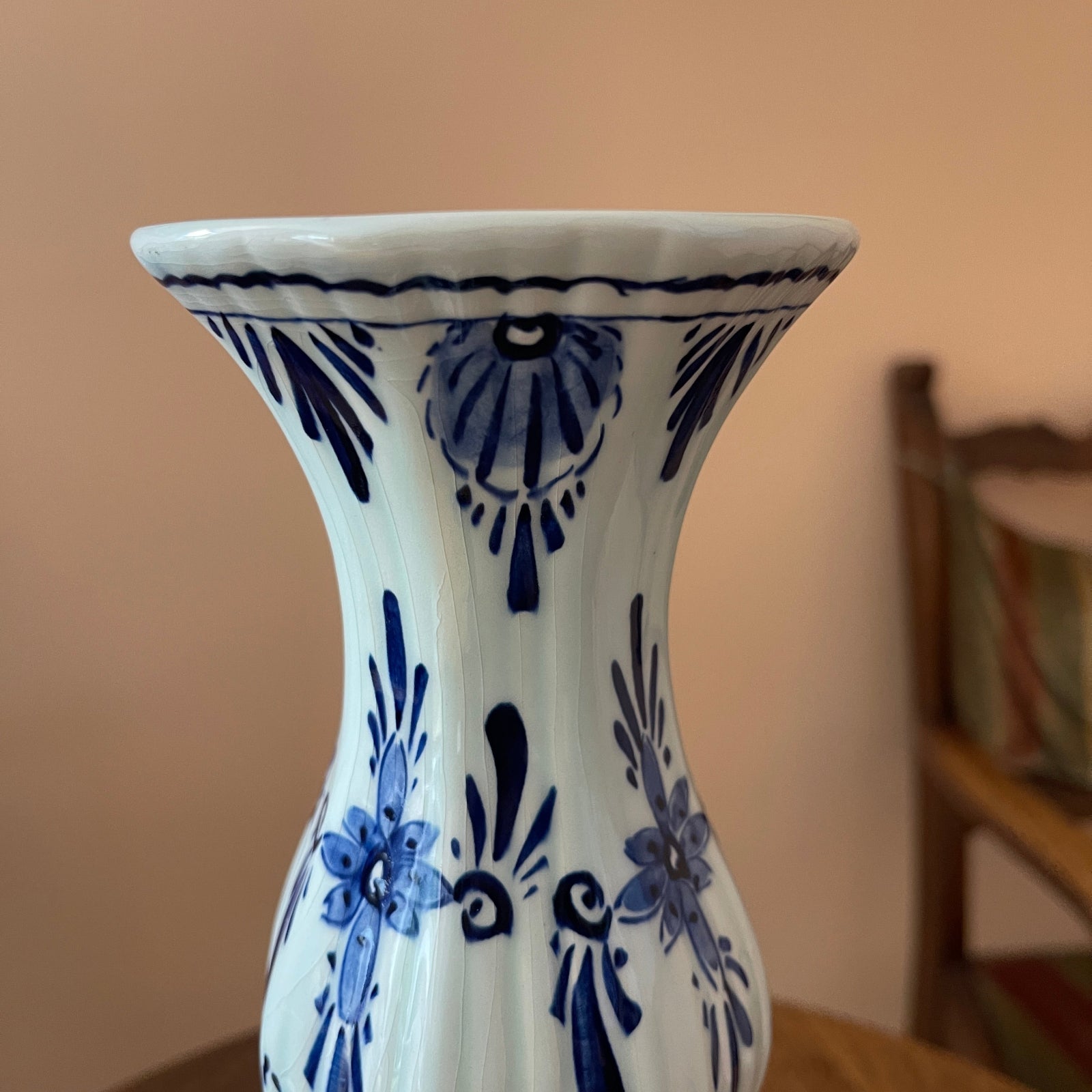 White vase with blue floral patterns on a blurred background