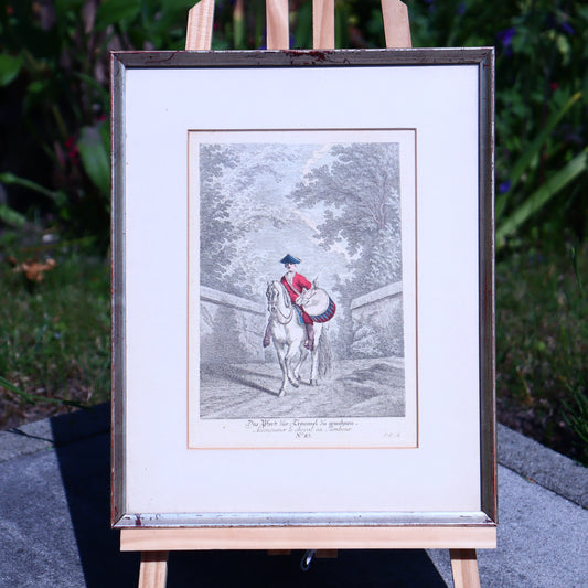 Framed artwork of a person on horseback outdoors