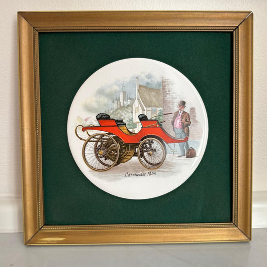 Framed artwork of a vintage red car and man on a white background