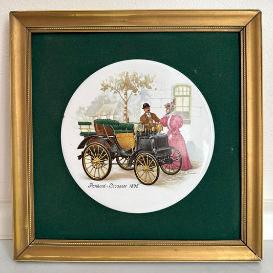 Framed artwork of a vintage car and couple on a green background