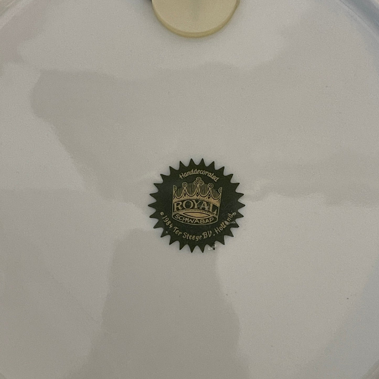 White shirt with a black logo on a white background