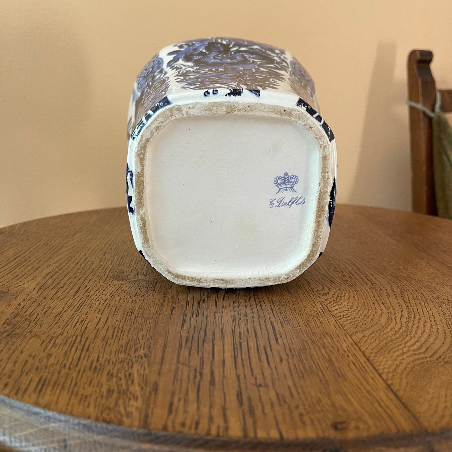 Ceramic container with decorative patterns on a wooden surface