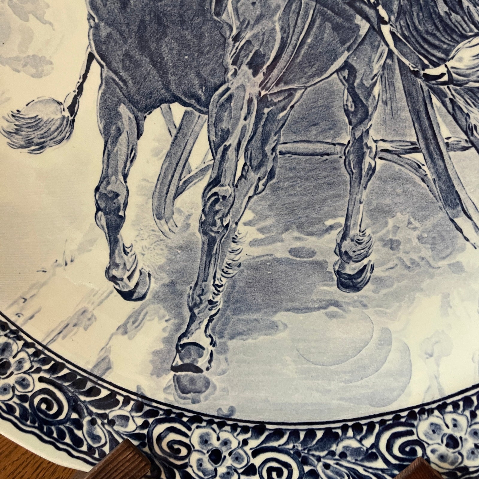 Decorative tile with a horse design on a beige background