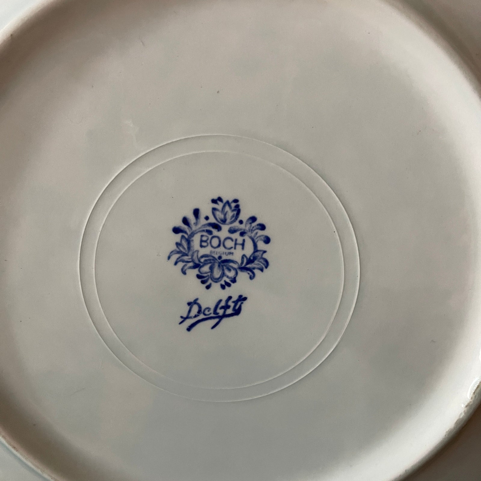 White plate with blue 'Boch Delft' logo