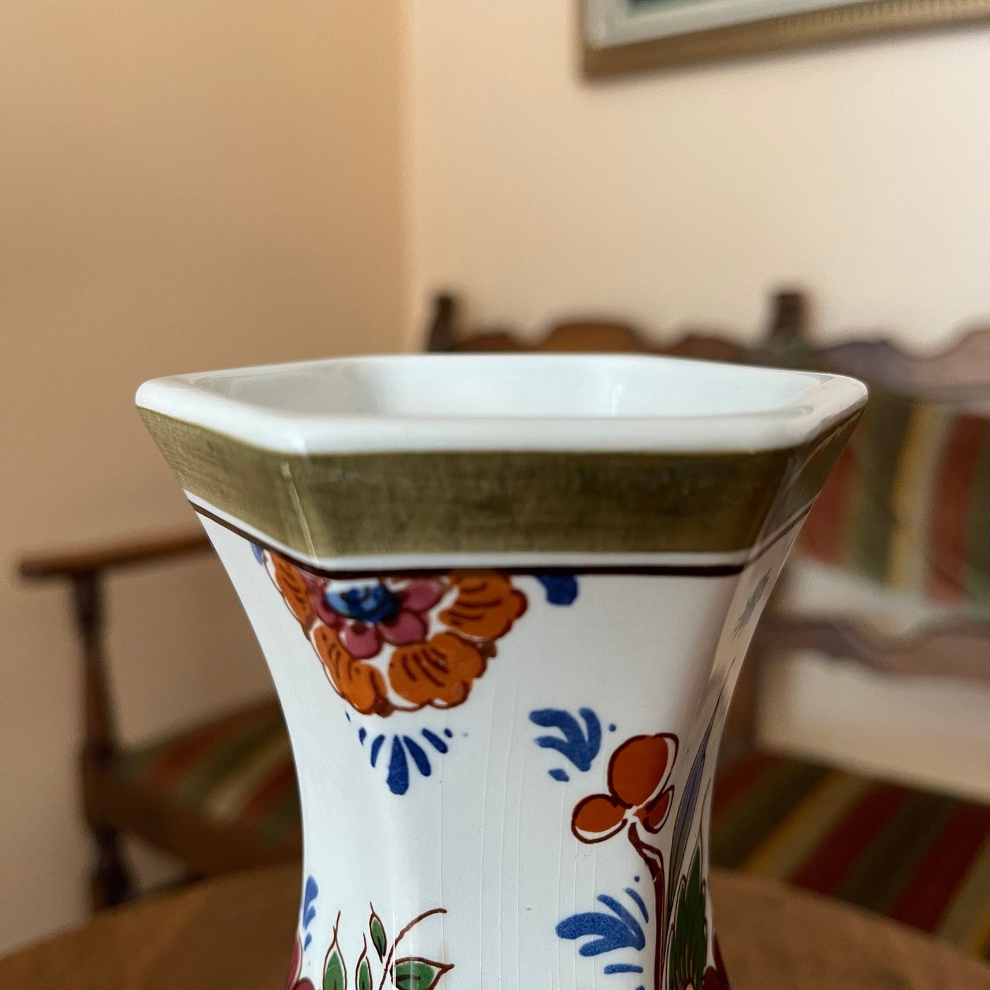 Decorative vase with floral patterns on a blurred background