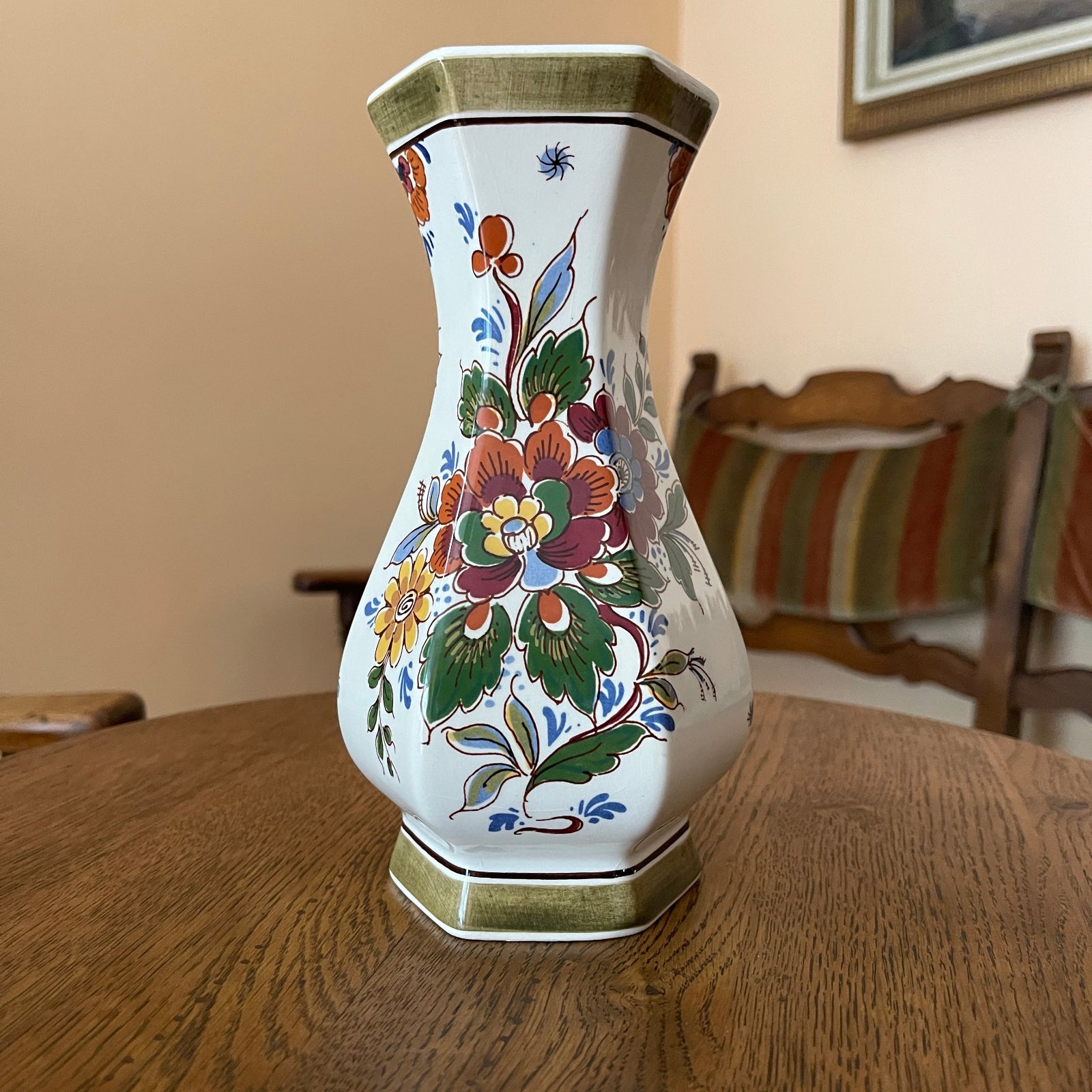 Decorative vase with floral patterns on a wooden table