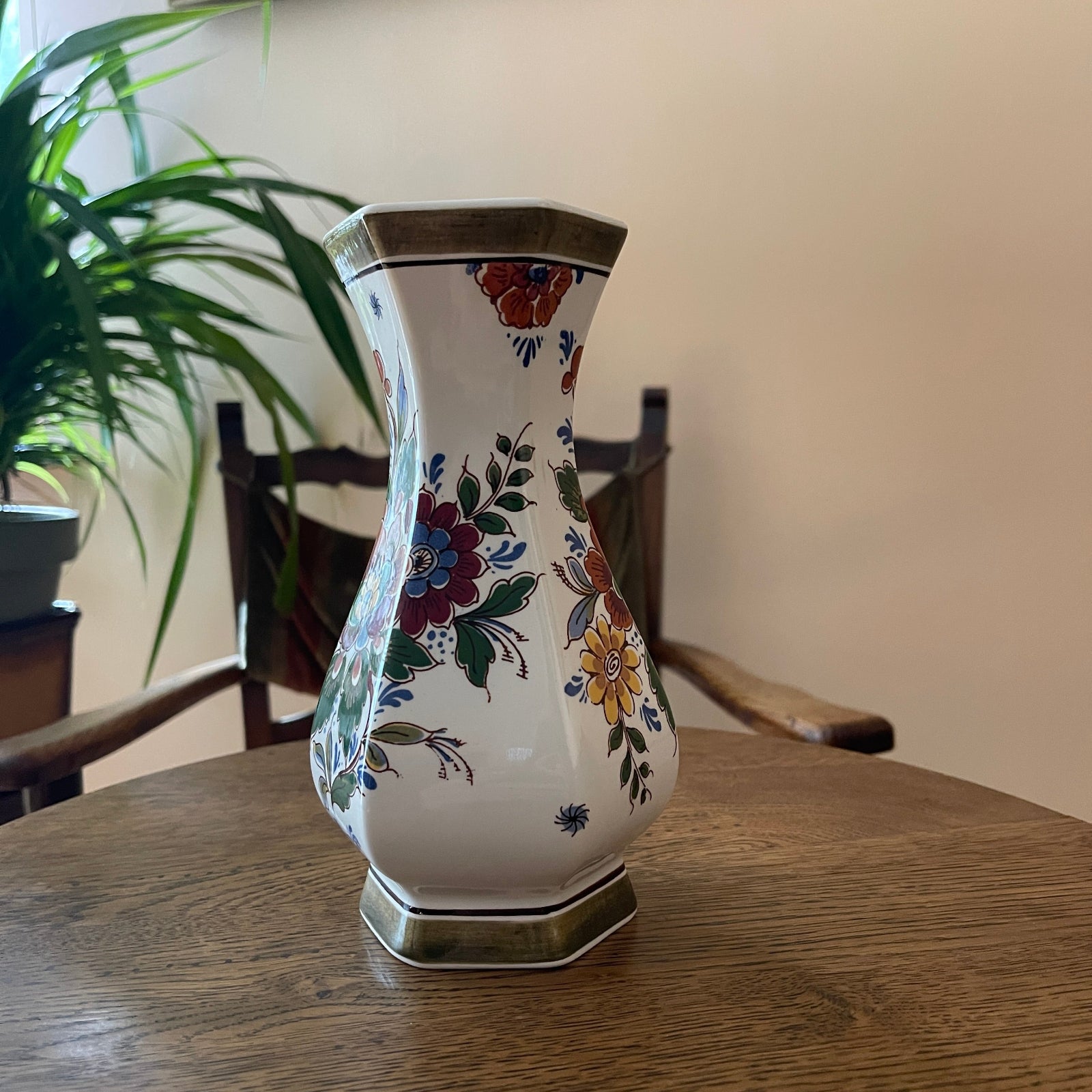 Decorative vase with floral patterns on a wooden table