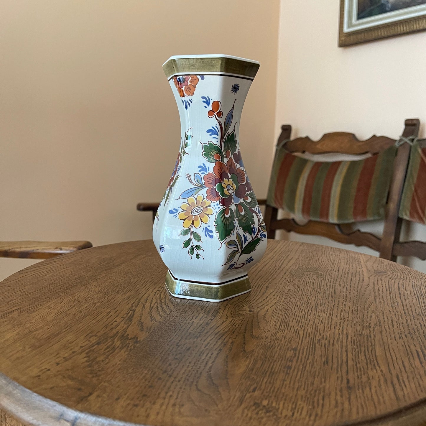 Decorative vase with floral patterns on a wooden table