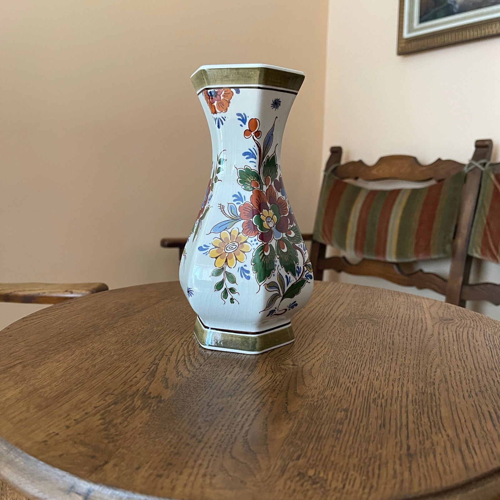 Decorative vase with floral patterns on a wooden table