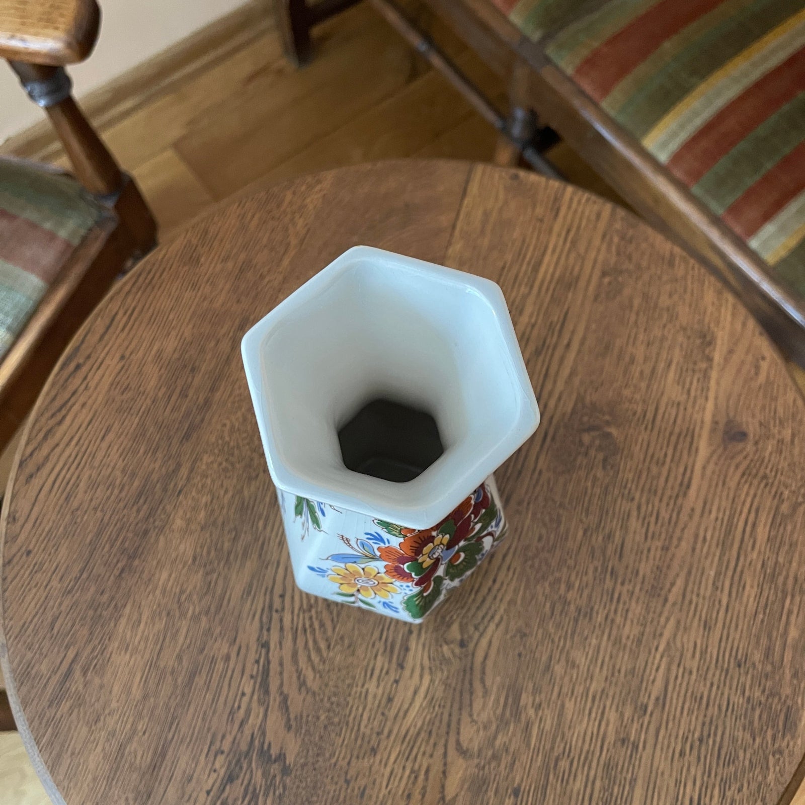 Decorative vase with floral patterns on a wooden table
