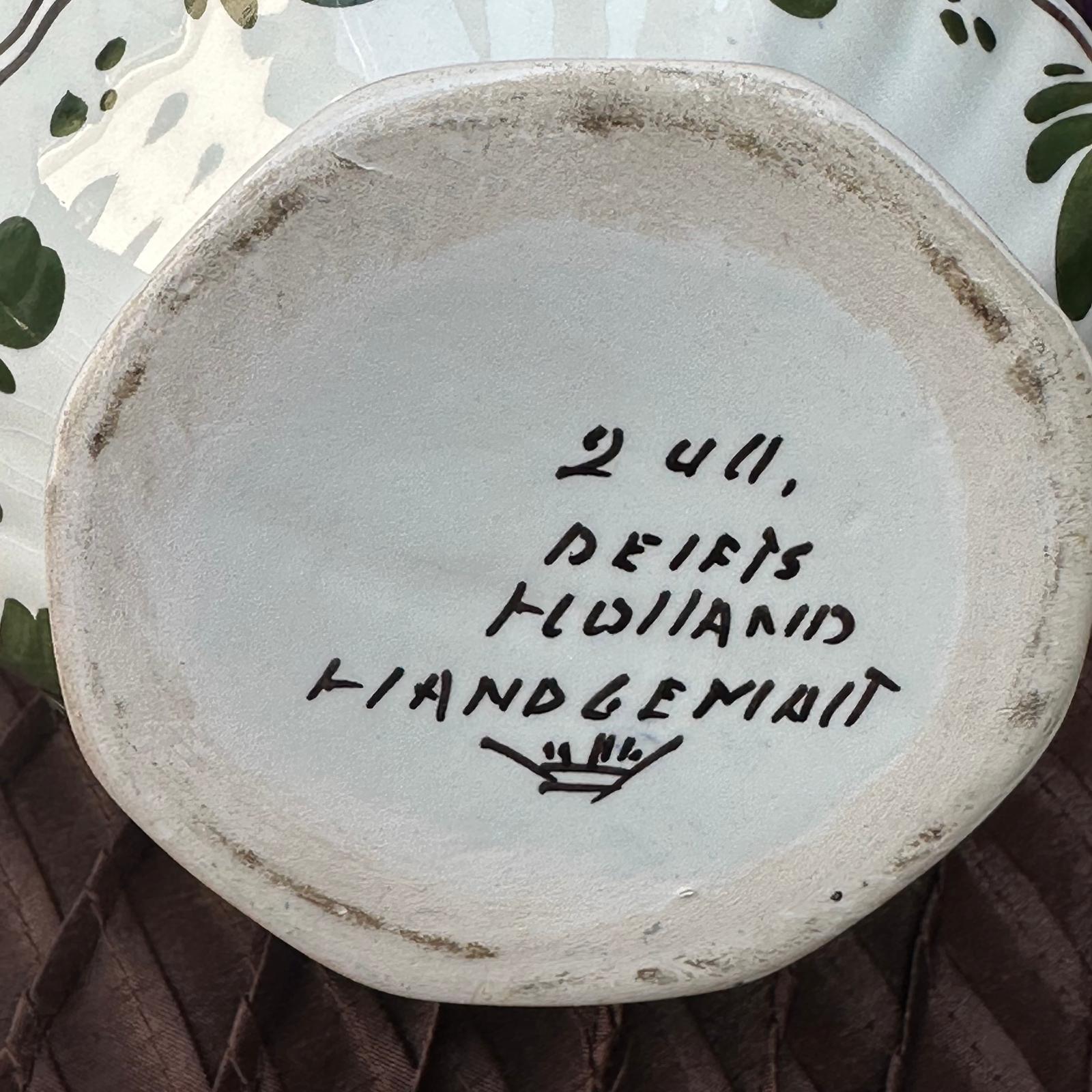 Ceramic plate with handwritten text on a textured surface