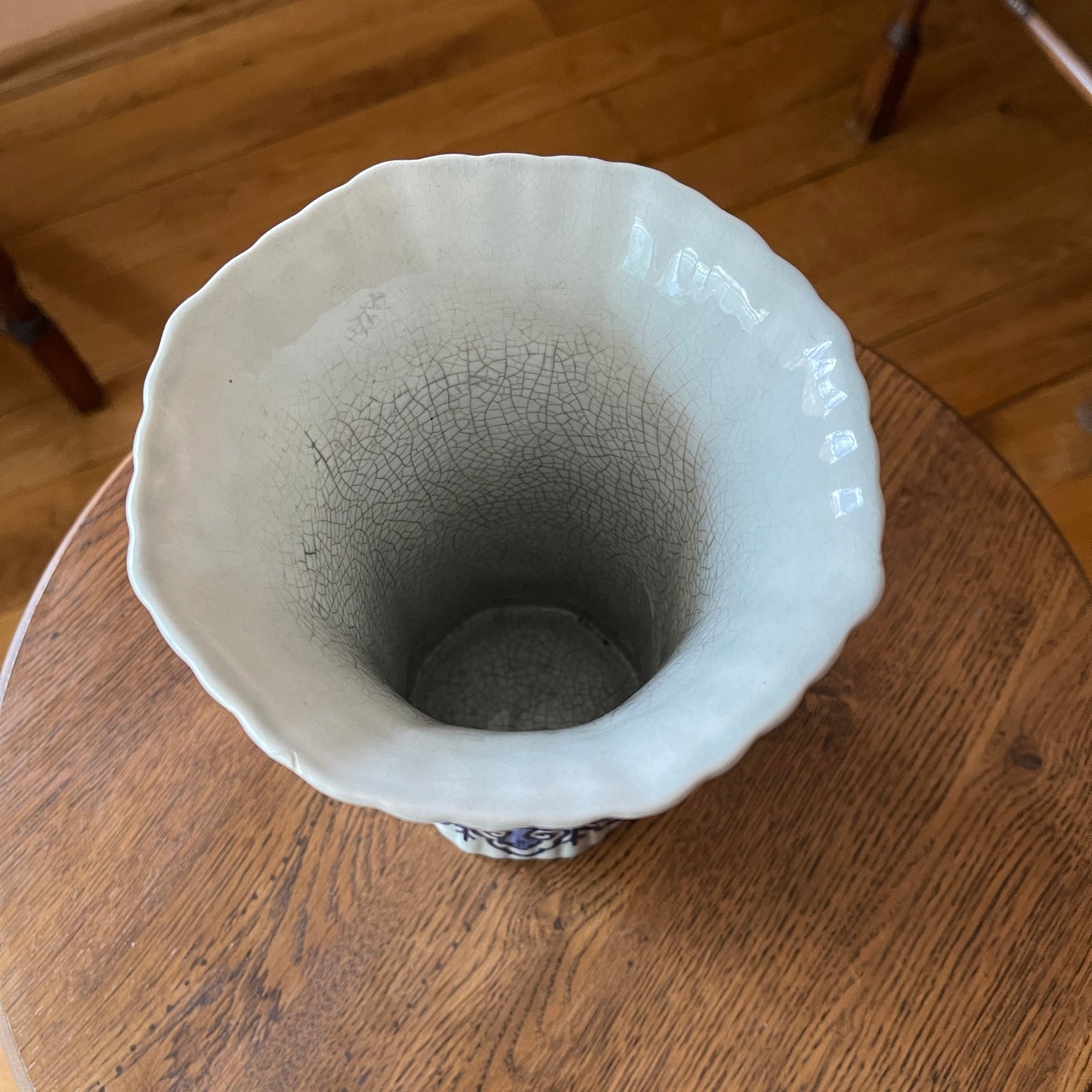 Blue and White ceramic vase on a wooden surface