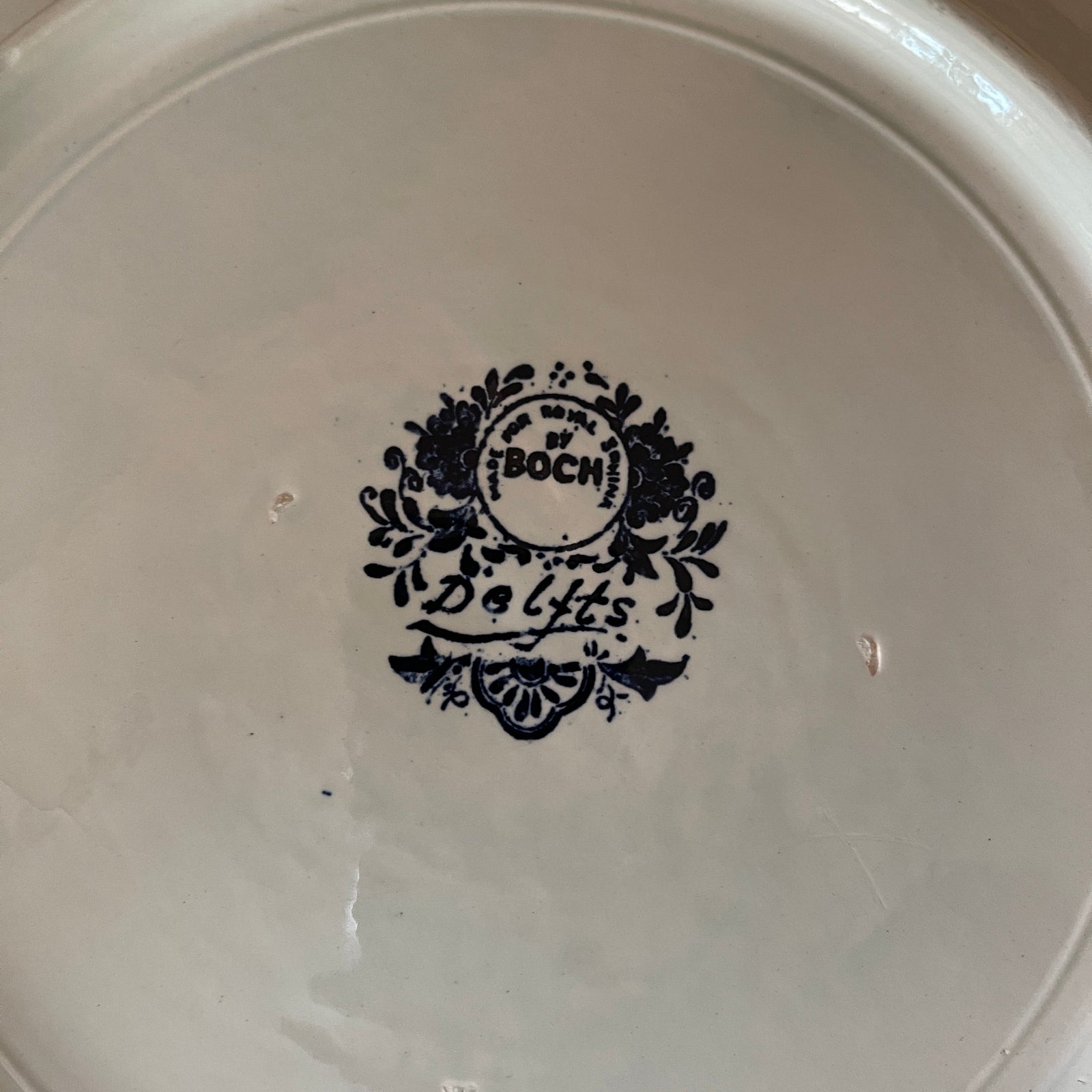 White ceramic plate with black 'Boch' logo in the center