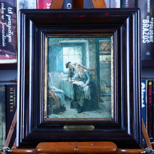 Framed artwork depicting a scene with a woman reading to a child in a room with a window and a chair. The frame is made of wood and the artwork is in oil paint.