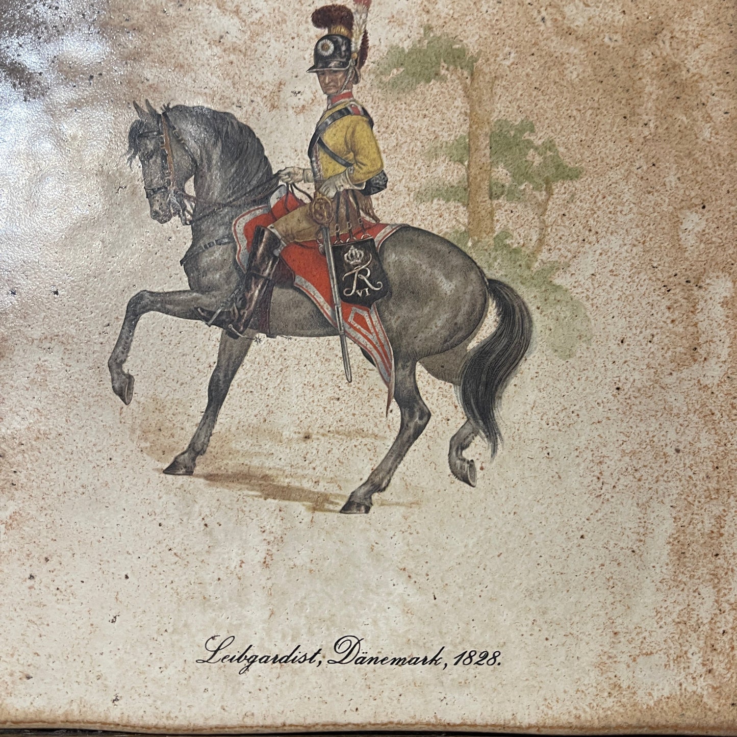 Painting of a soldier on horseback with a decorative saddle, dated 1828, on a textured beige background.