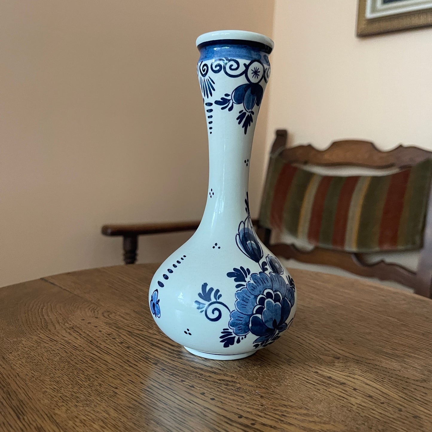 White vase with blue floral patterns on a wooden table