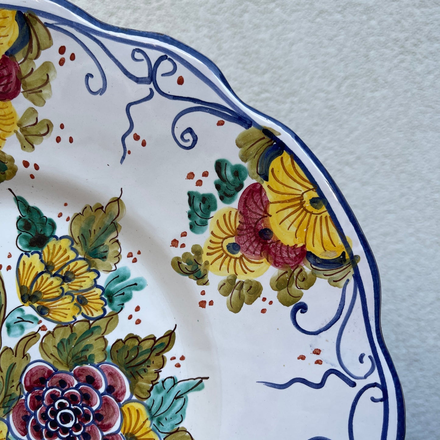 Decorative ceramic plate with floral patterns on a white background