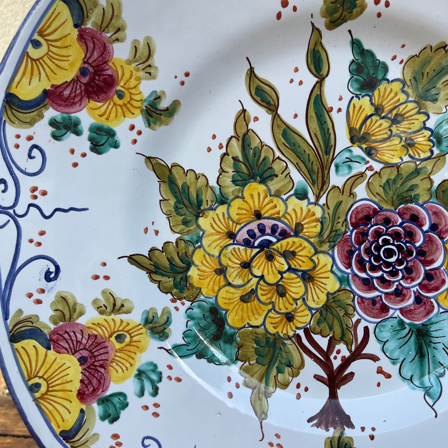 Decorative plate with colorful floral design on a white background
