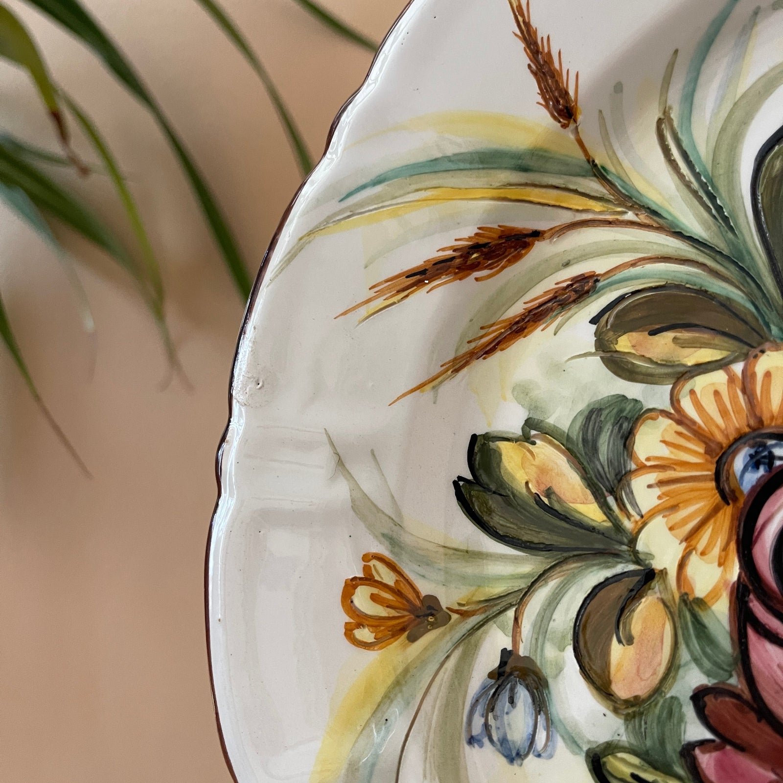 Decorative ceramic plate with floral patterns on a neutral background