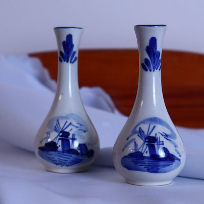 A pair of tiny vases with a Delft-style pattern