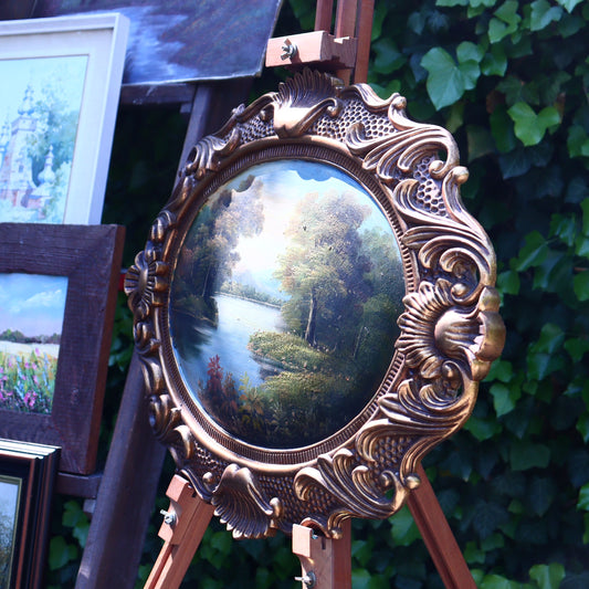 Landscape on wood in an oval frame
